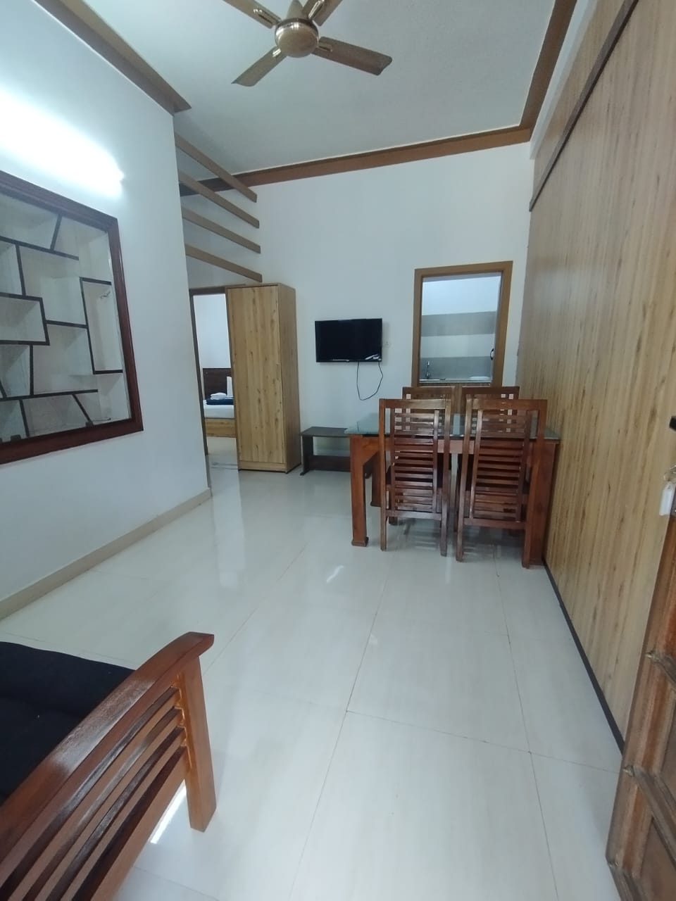 Living room with dining table and TV